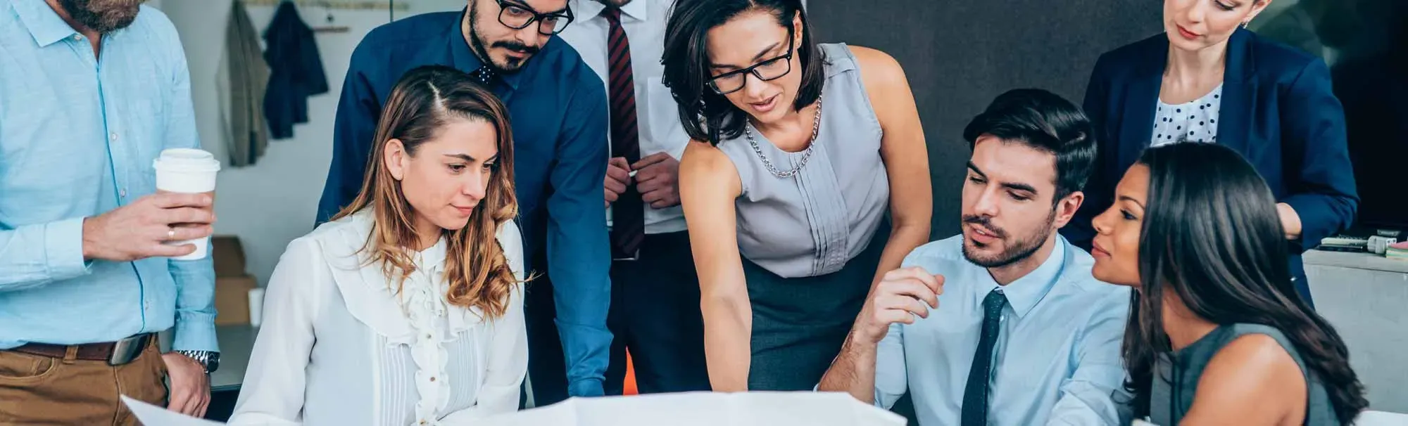 A diverse group of people gathered around a table